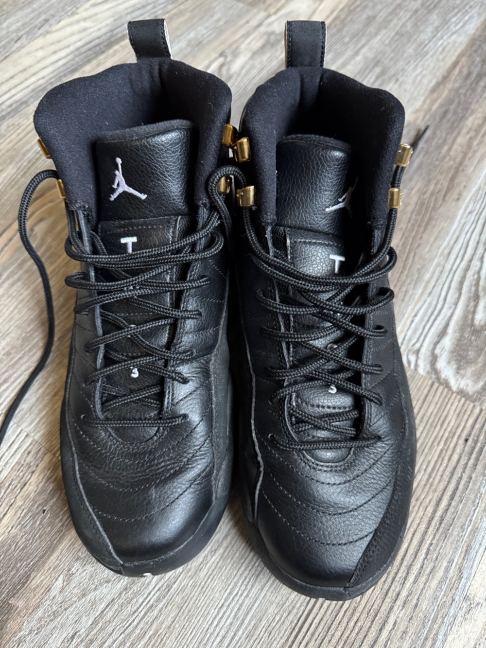 Jordan Black High-Top Leather Sneakers with Gold Accents